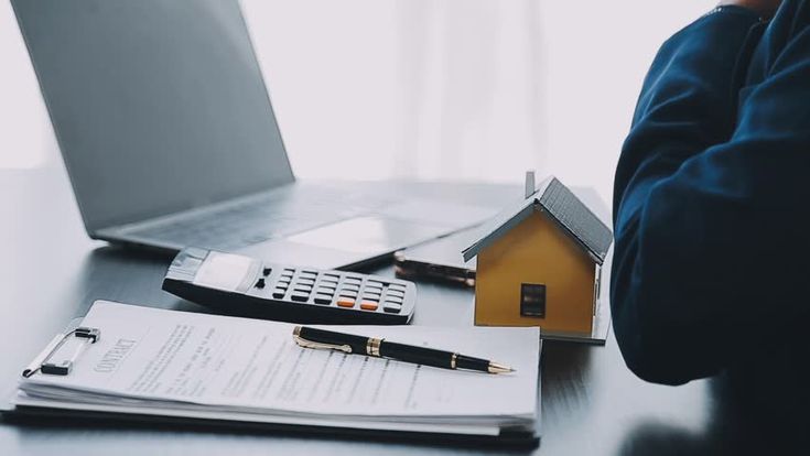 Nigerian investor checking real estate documents to avoid property scams.